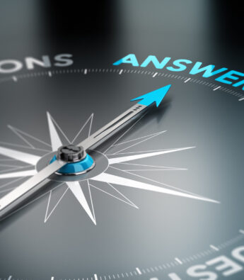 Realistic conceptual 3D render image with depth of field blur effect. Compass with the needle pointing the word answer, black background. Concept for business solutions.